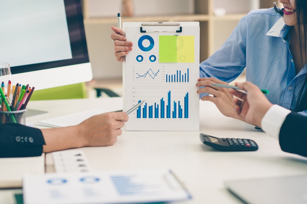 Business,People,Discussing,The,Charts,And,Graphs,Showing,The,Results